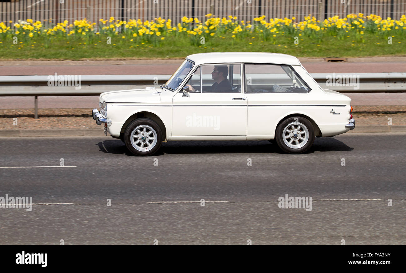 A vintage 1960`s Hillman Imp travelling along the Kingsway Dual Carriageway in Dundee, UK Stock Photo
